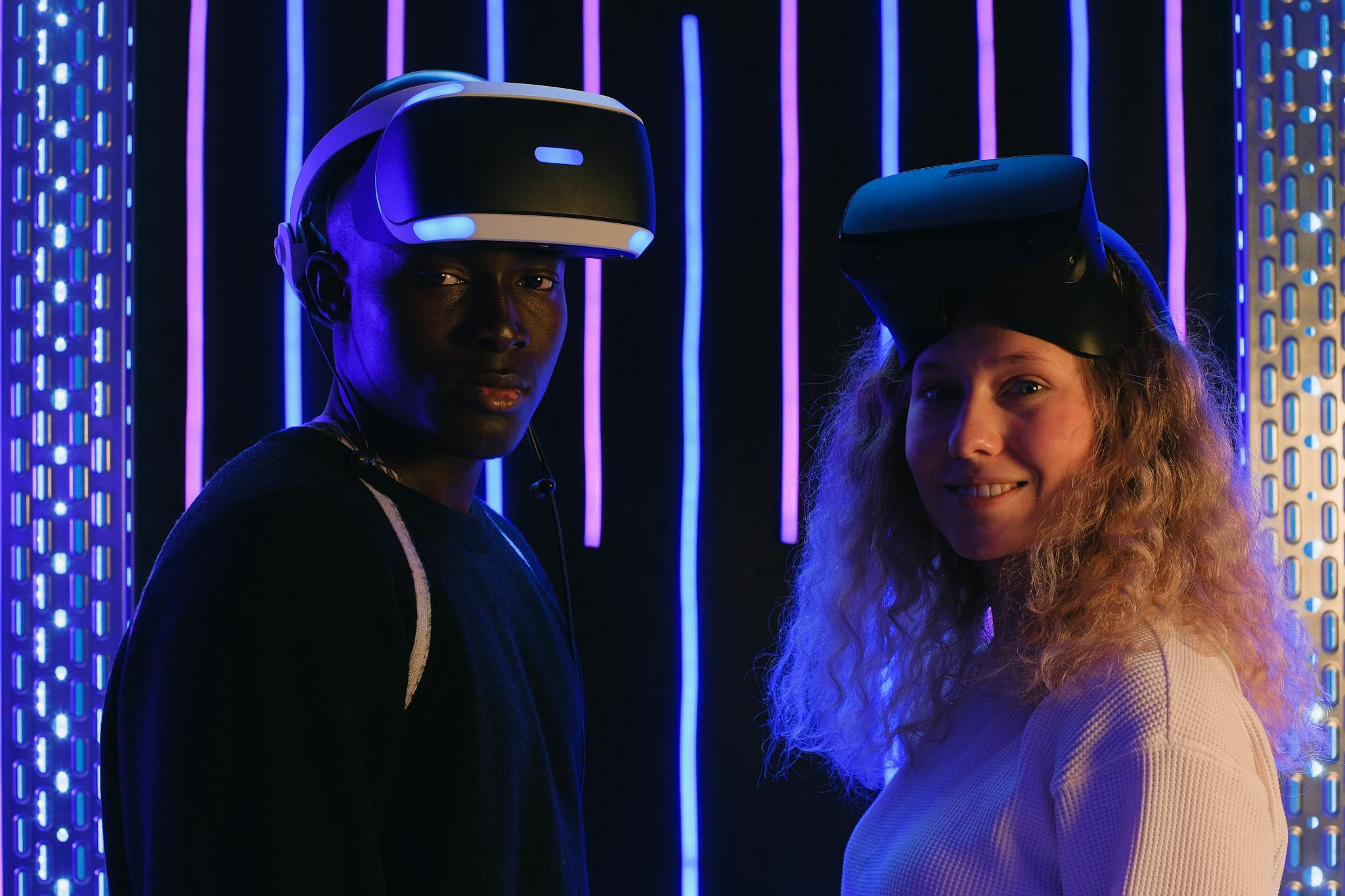 Two people immersing in a virtual reality environment, showcasing technology and diversity.